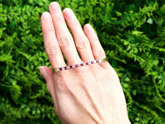 ruby and diamond yellow gold bangle outside