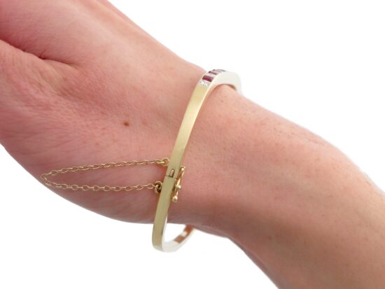 ruby and diamond yellow gold bangle wearing