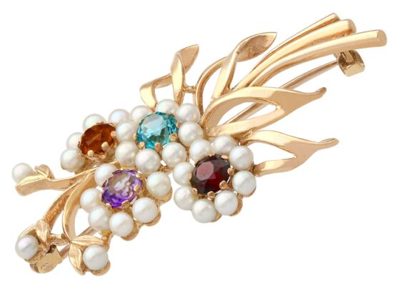 Yellow Gold Gemstone Brooch Closeup