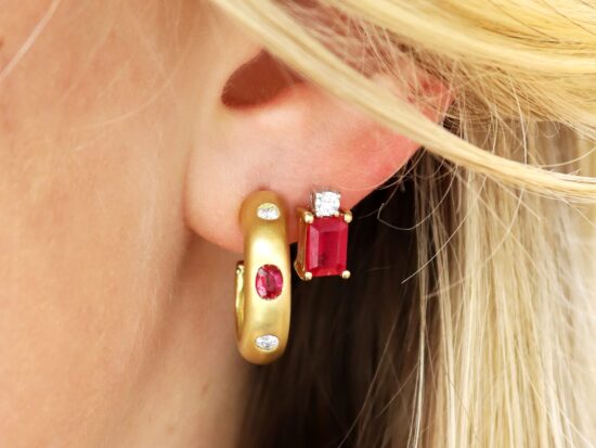 wearing ruby and diamond earrings