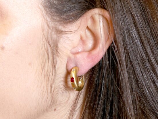 wearing ruby and diamond earring