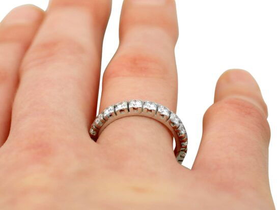 White Gold & Diamond Eternity Ring on finger