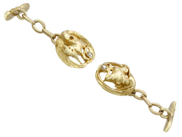 pair of gold bird cufflinks