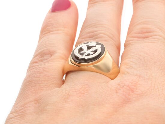 onyx Army Signet Ring in gold on finger