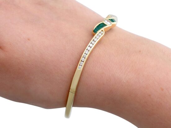 Emerald and Diamond Bangle in Yellow Gold on wrist
