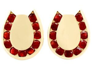 gold horseshoe cufflinks with garnets