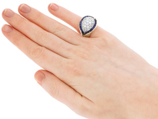 unusual gold sapphire and diamond ring on hand