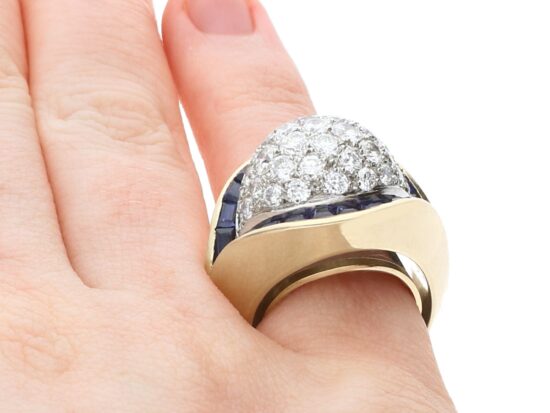 wearing unusual gold sapphire and diamond ring