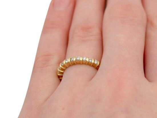 Yellow Gold Full Diamond Eternity Ring on finger