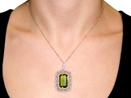 wearing Antique Peridot Pendant in Yellow Gold