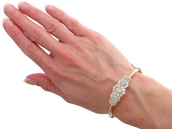 Victorian opal and diamond yellow gold bangle wearing