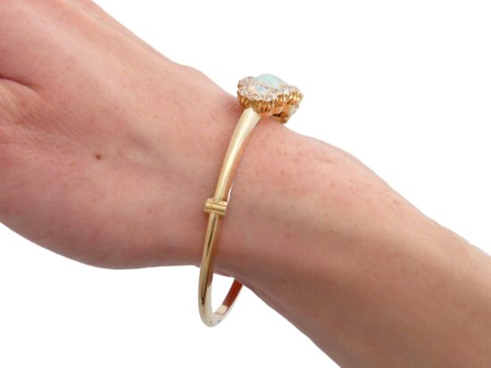 Victorian opal and diamond yellow gold bangle wearing