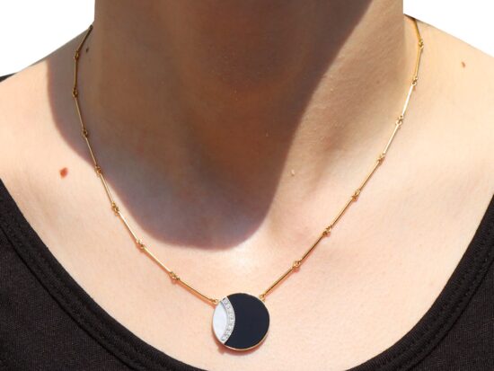 wearing Black Onyx Pendant in Yellow Gold