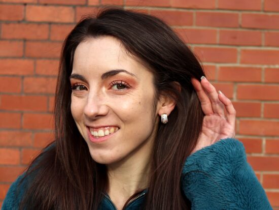 Vintage Gemstone Earrings Being Worn