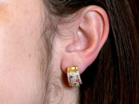 Multicoloured Earrings On Ear Closeup