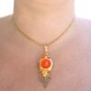 Wearing Coral Diamond Necklace