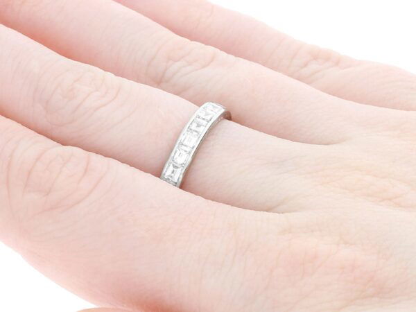 princess and baguette cut eternity ring on hand