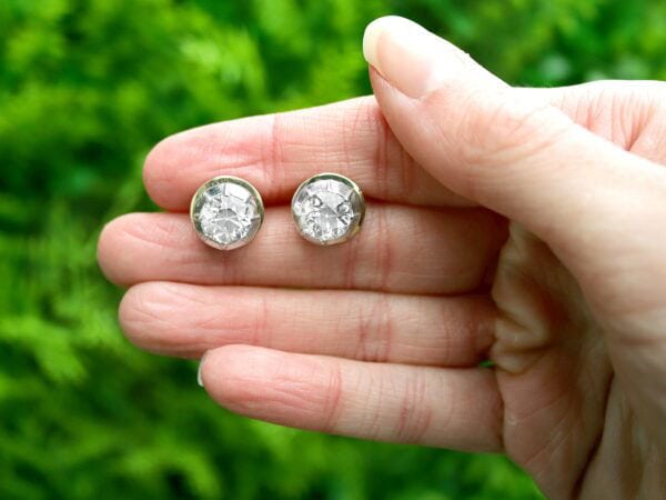 Old European diamond stud earrings outside