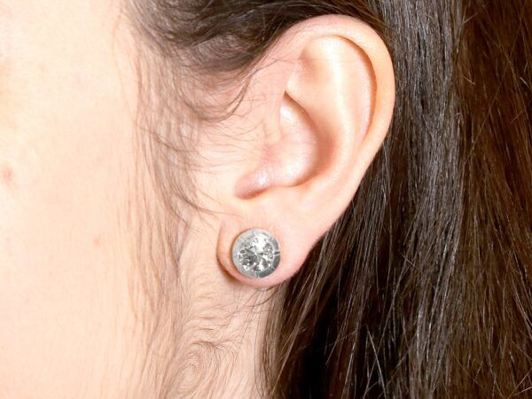 wearing Old European diamond stud earrings