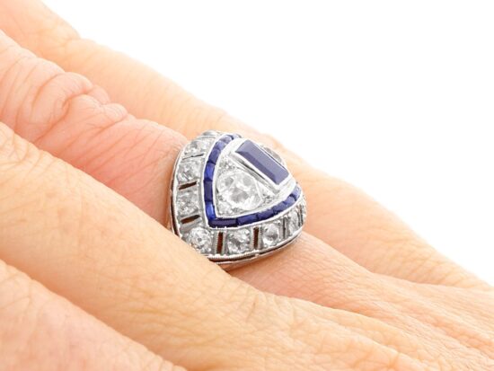 French platinum sapphire and diamond ring on finger