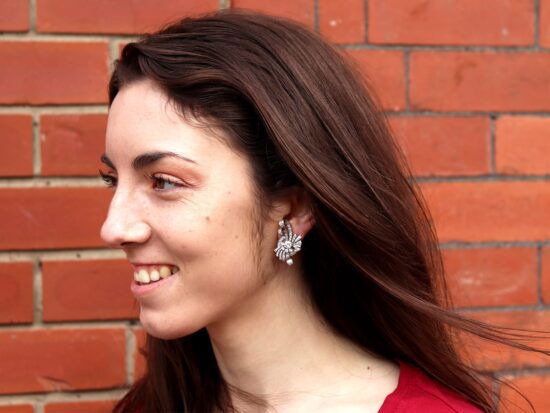 art deco diamond earrings being worn