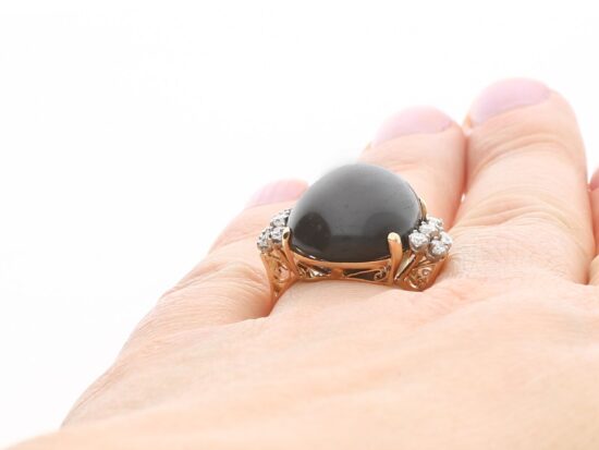 Star Onyx Ring with Diamonds on finger