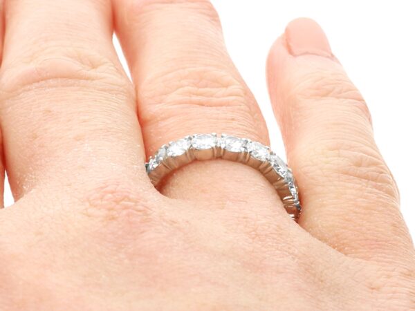 Platinum Eternity Ring with Diamonds on finger