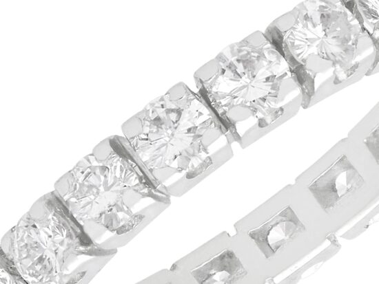 close up of 4 Claw Set diamond Eternity Ring