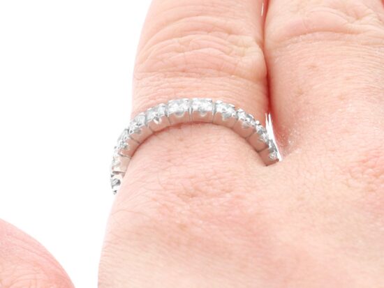 4 Claw Set diamond Eternity Ring on finger
