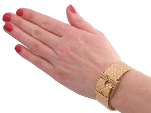 Gold Buckle Bangle On Wrist