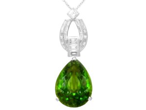 Pear shaped peridot pendant in platinum with diamonds