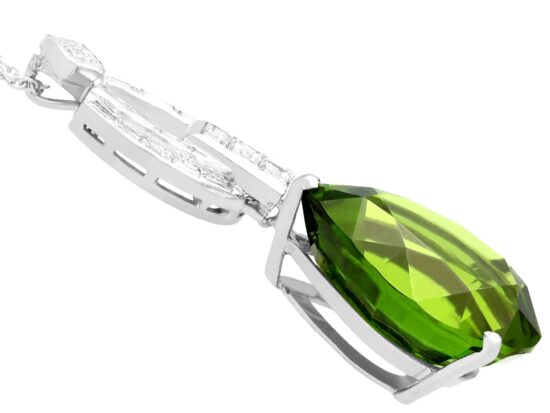 Pear shaped peridot pendant in platinum with diamonds