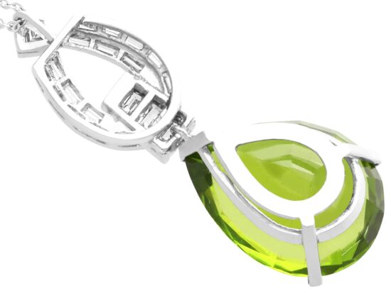 Pear shaped peridot pendant in platinum with diamonds reverse