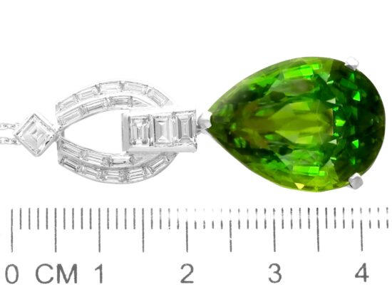 Pear shaped peridot pendant in platinum with diamonds size