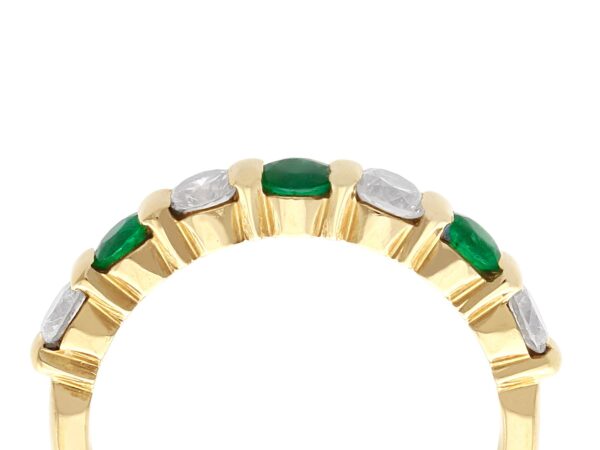 emerald and diamond eternity ring in gold