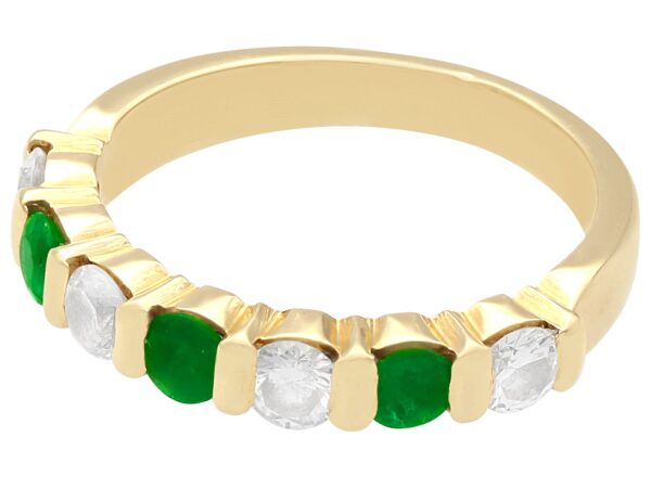 emerald and diamond eternity ring in yellow gold