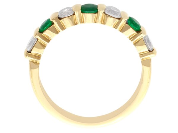 emerald and diamond eternity ring in 18k yellow gold