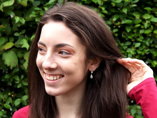 Pear Diamond Earrings Being Worn