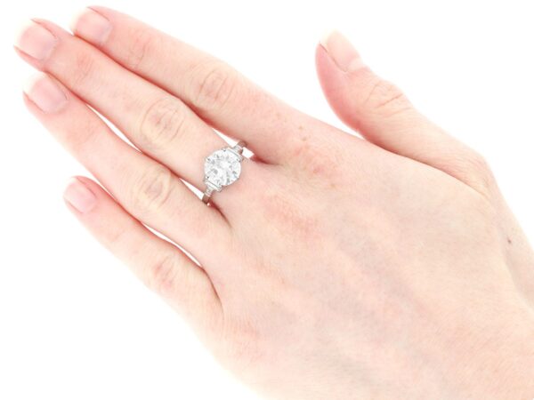 1930s diamond solitaire ring on hand