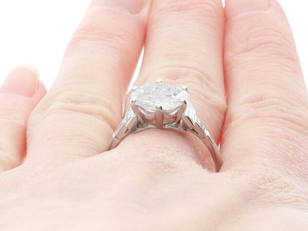 wearing a 1930s diamond solitaire ring