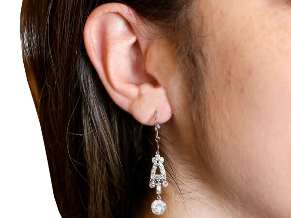 wearing Art Deco diamond earrings