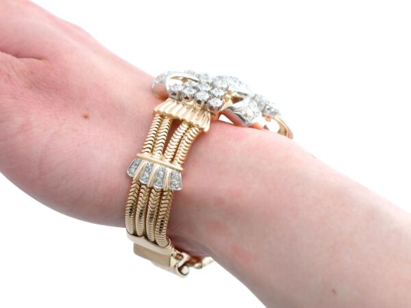 gold art deco bracelet on wrist