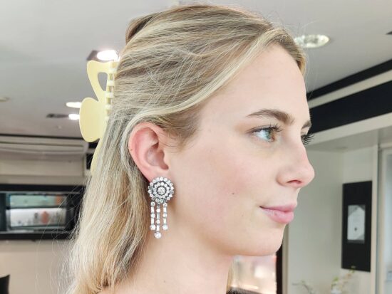 White Gold Earrings Being Worn