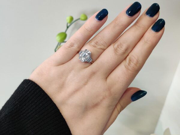 emerald cut diamond ring in platinum on hand