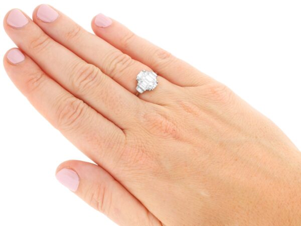emerald cut diamond ring on hand