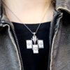 wearing a mother of pearl necklace
