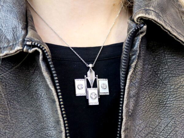 wearing a mother of pearl necklace