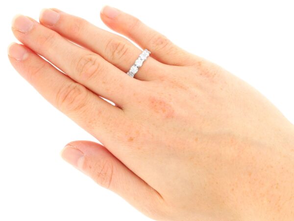 white gold eternity ring for women on hand