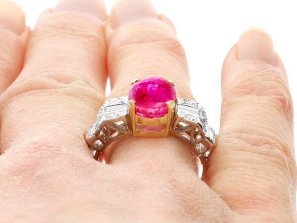 art deco Burmese ruby and diamond ring on finger