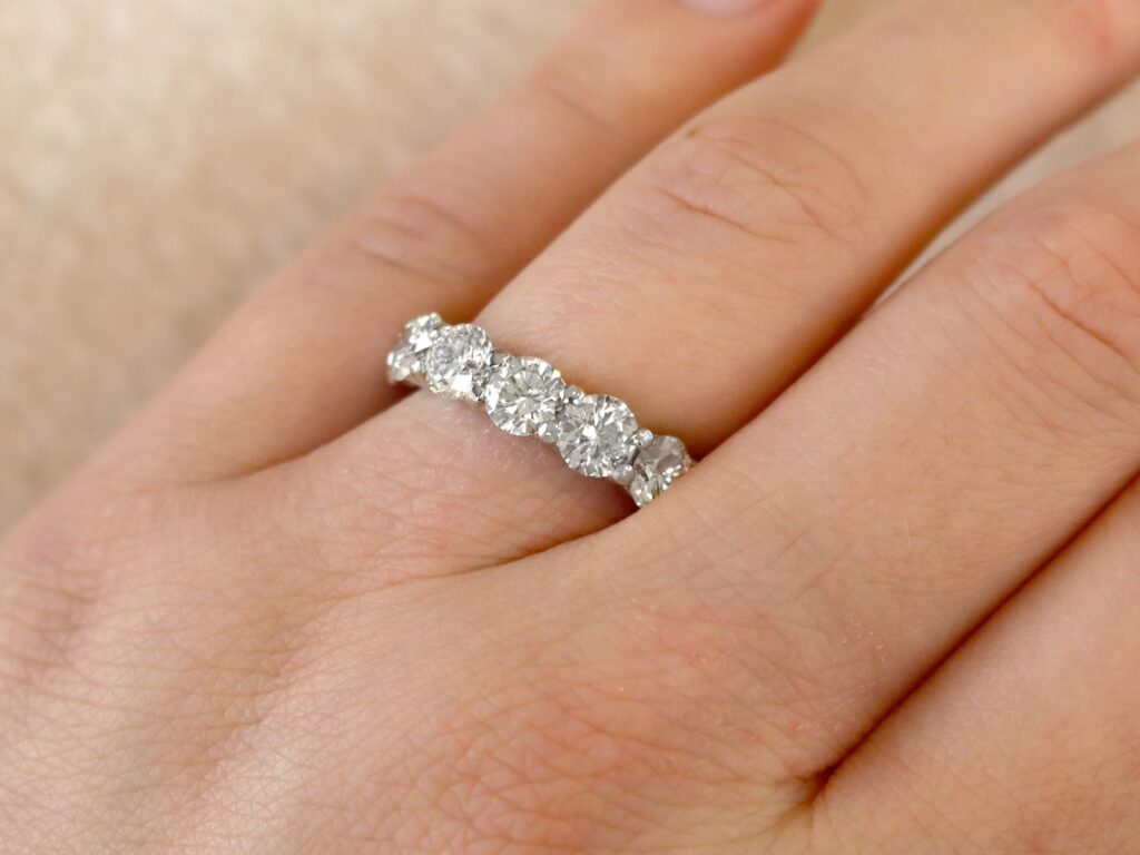 wearing a white gold diamond eternity ring